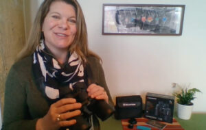 Sarah holding binoculars